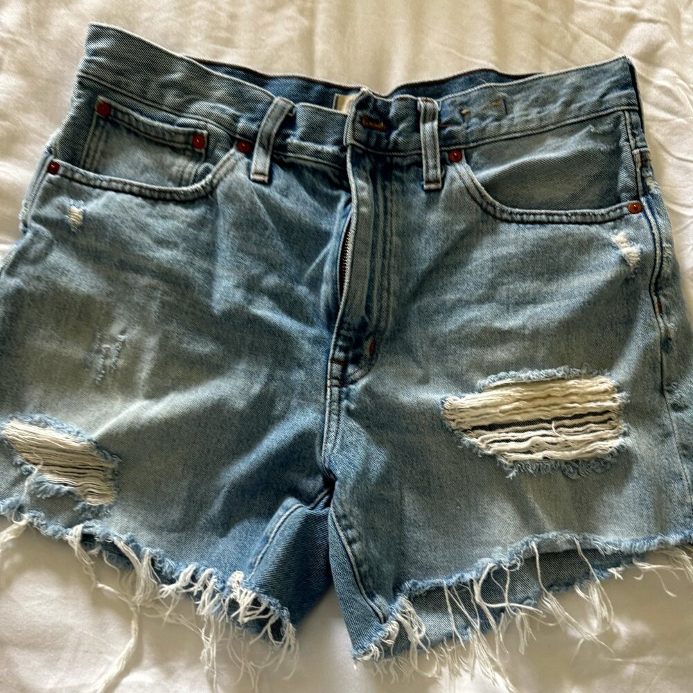 Madewell distressed mid length denim shorts